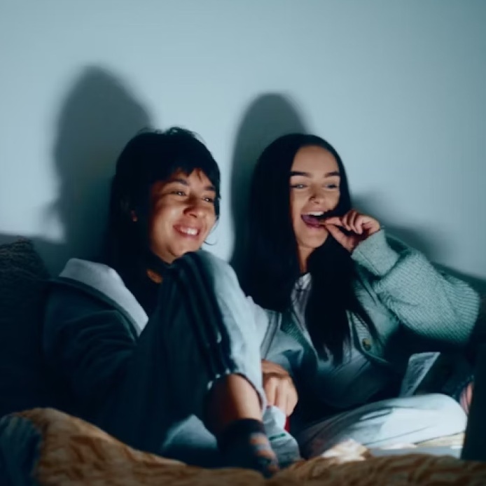 Two students watching movie